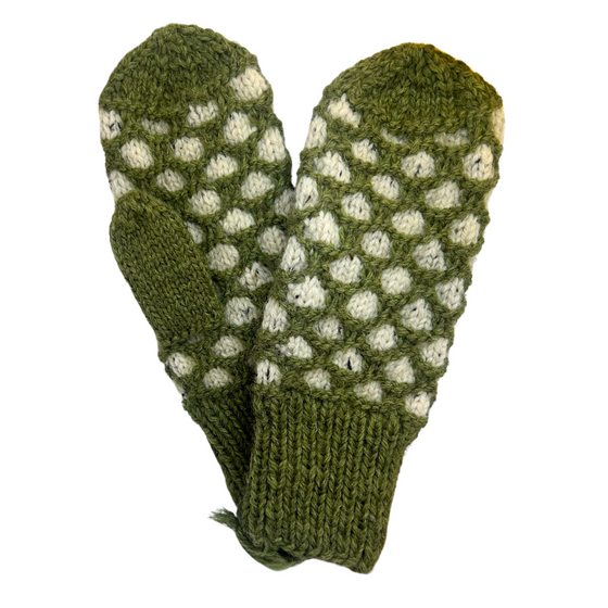 A pair of green and white wool mittens arranged in the shape of a heart. The main colour is green, with honeycombs of white throughout the body. Cuffs, ends, and thumbs are green.