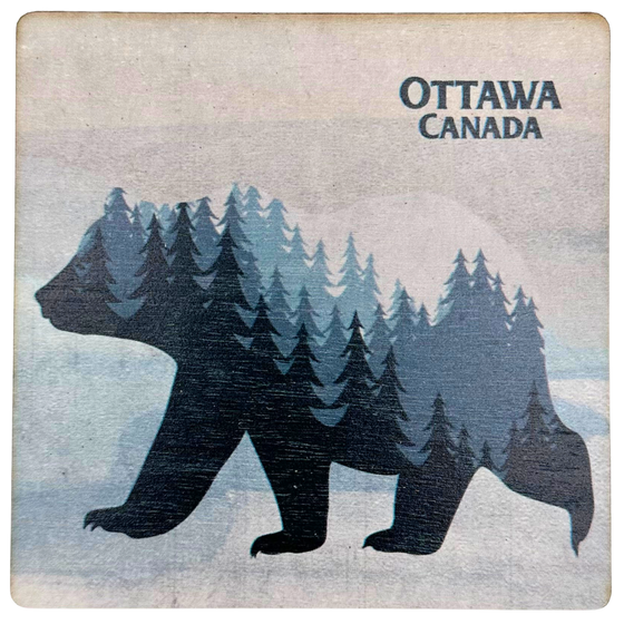 A square wooden coaster with a bear in silhouette walking against a distressed wood background. Inside the bear is a graphic of a forested mountainscape. In the top left, the coaster says "Ottawa Canada"