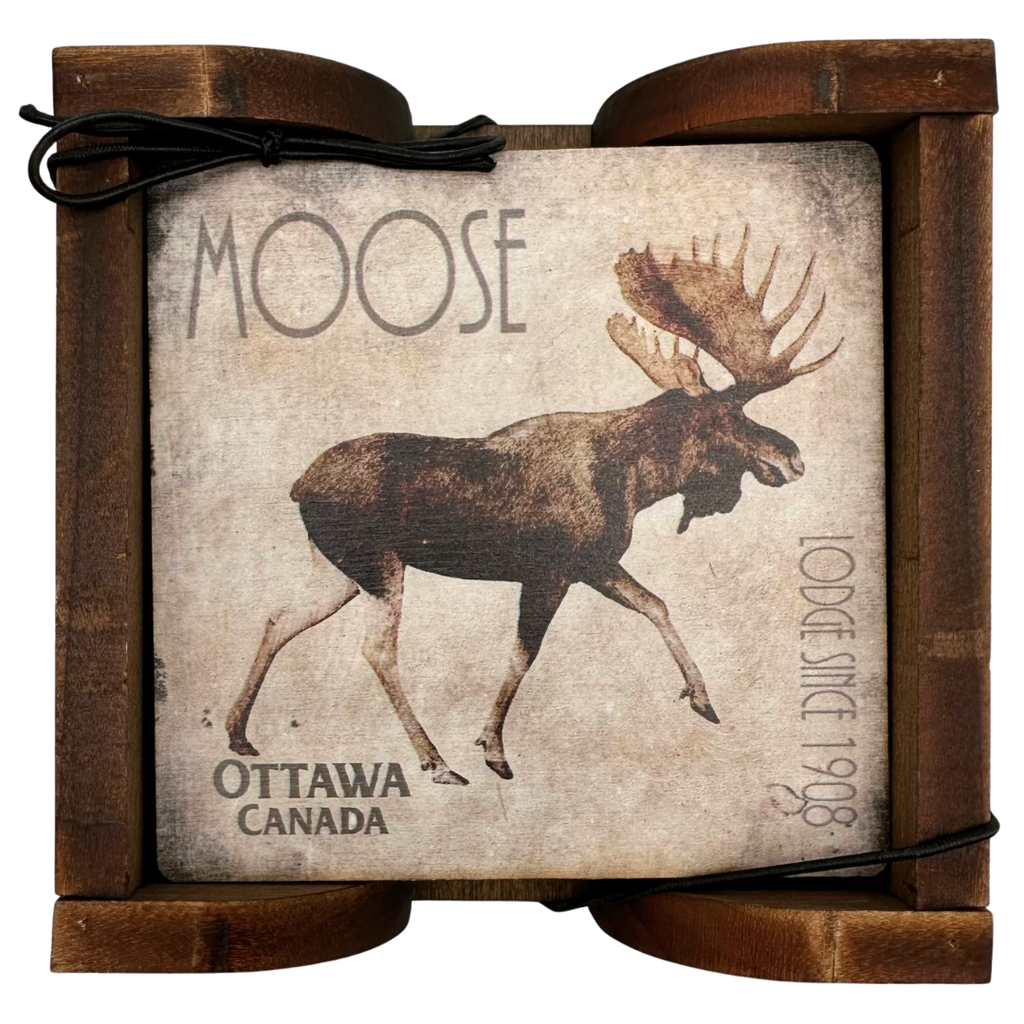 A square wooden coaster displayed in an attractive wooden holder. The coaster shows a moose walking against a distressed wood background. The coasters says "Moose" in the top left, "Ottawa Canada" in the bottom left, and "Lodge since 1908" along the right side.