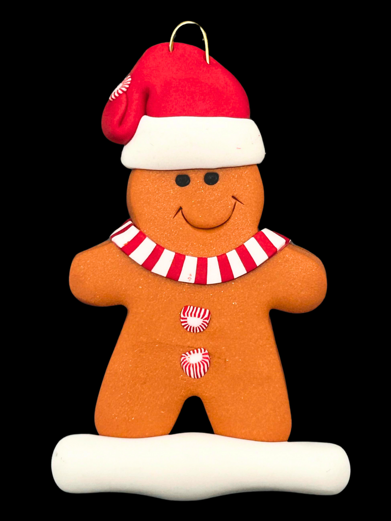 A gingerbread man wearing a red Santa hat, red and white mints as buttons, and a red and white striped scarf.