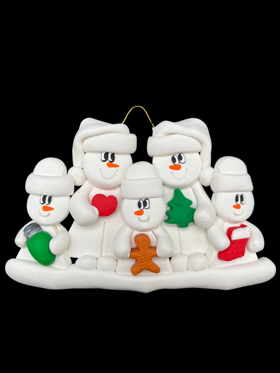 A family of five snowmen in white hats smile at each other. The two large ones hold a heart and a Christmas tree. The three smaller ones in front hold a wrapped gift, a gingerbread man, and a Christmas stocking.