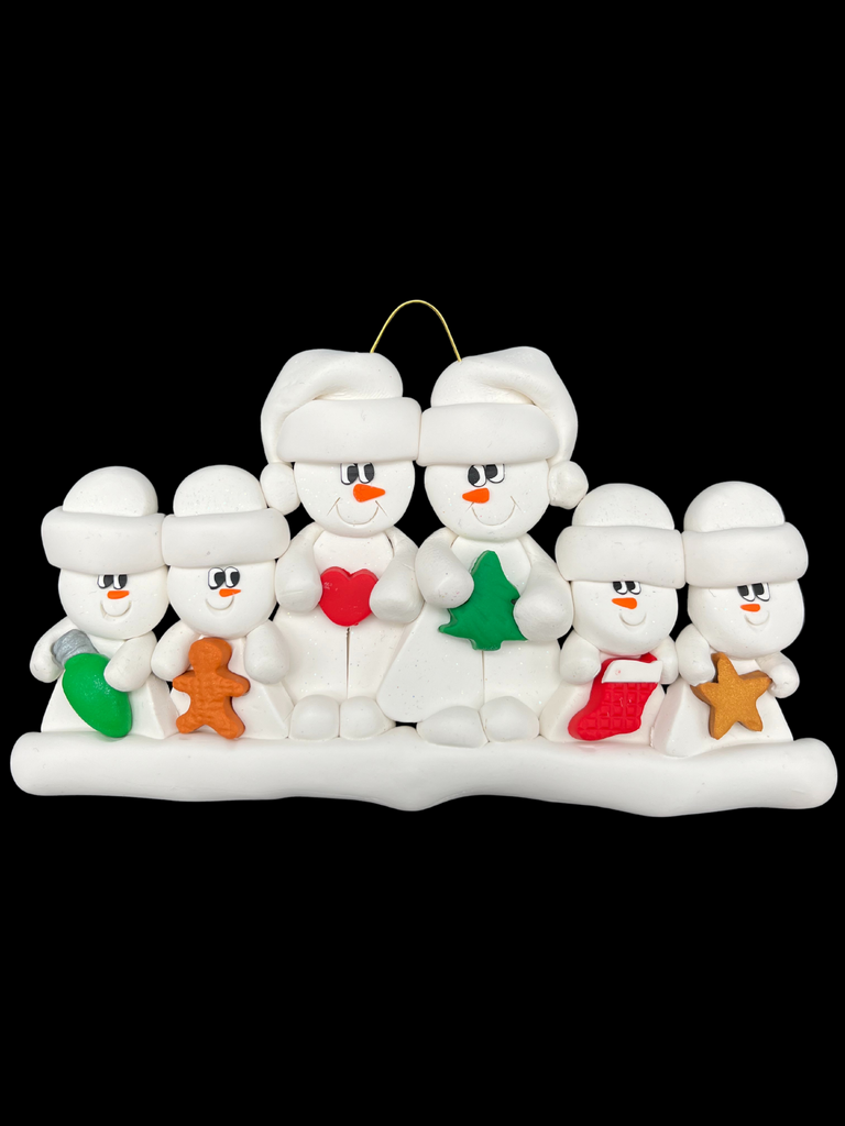 A family of six snowmen in white hats smile at each other. The two large ones hold a heart and a Christmas tree. The four smaller ones in front hold a wrapped gift, a gingerbread man, a Christmas stocking, and a gold star.