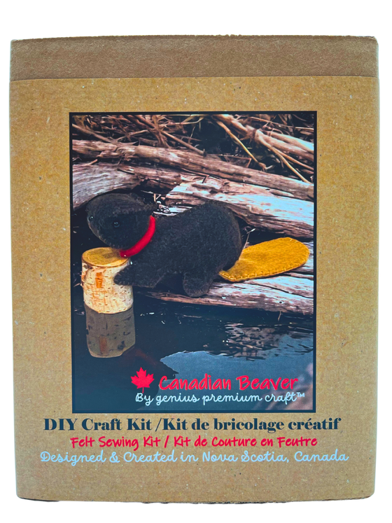 A handmade felted Canadian beaver with bright red collar sits with a decorative log. The body is dark brown and the tail is a complementary lighter brown.