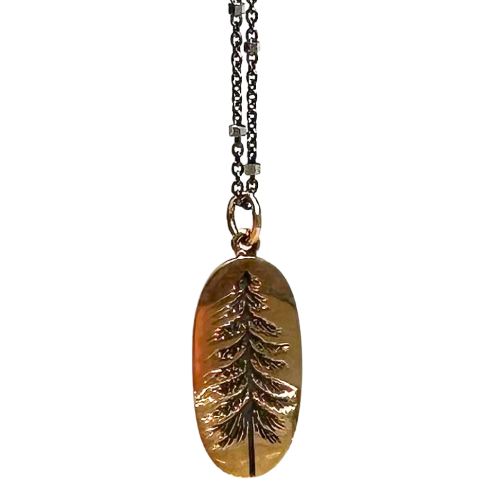 Black chain with thin hexagonal silver rings that are evenly distributed throughout the chain. Pendant is a gold-bronze oval with the indentation of a pine tree. The indentation is black.