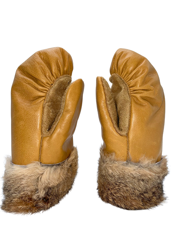 A pair of light beige leather mitts with short beige and grey sealskin fur at the bottom.