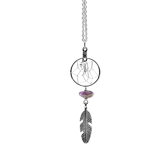 A silver dream catcher necklace with a small amethyst stone underneath, and a silver feather hanging from the stone.