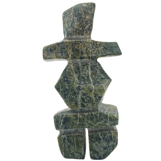 A human-shaped inukshuk sculpture, approximately 3 inches high. The stone is mottled black and green soapstone.