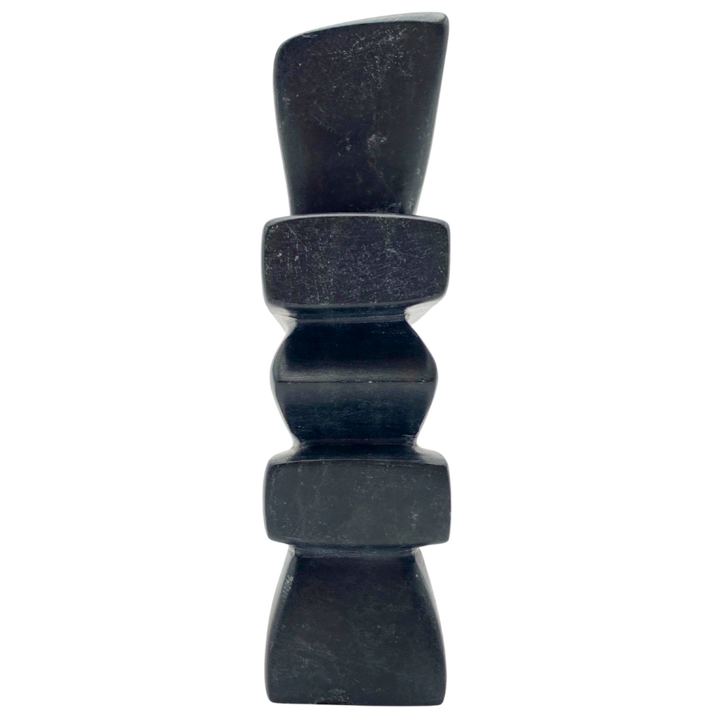 A human-shaped inukshuk sculpture, approximately 5 inches. The soapstone is black with green marbling.