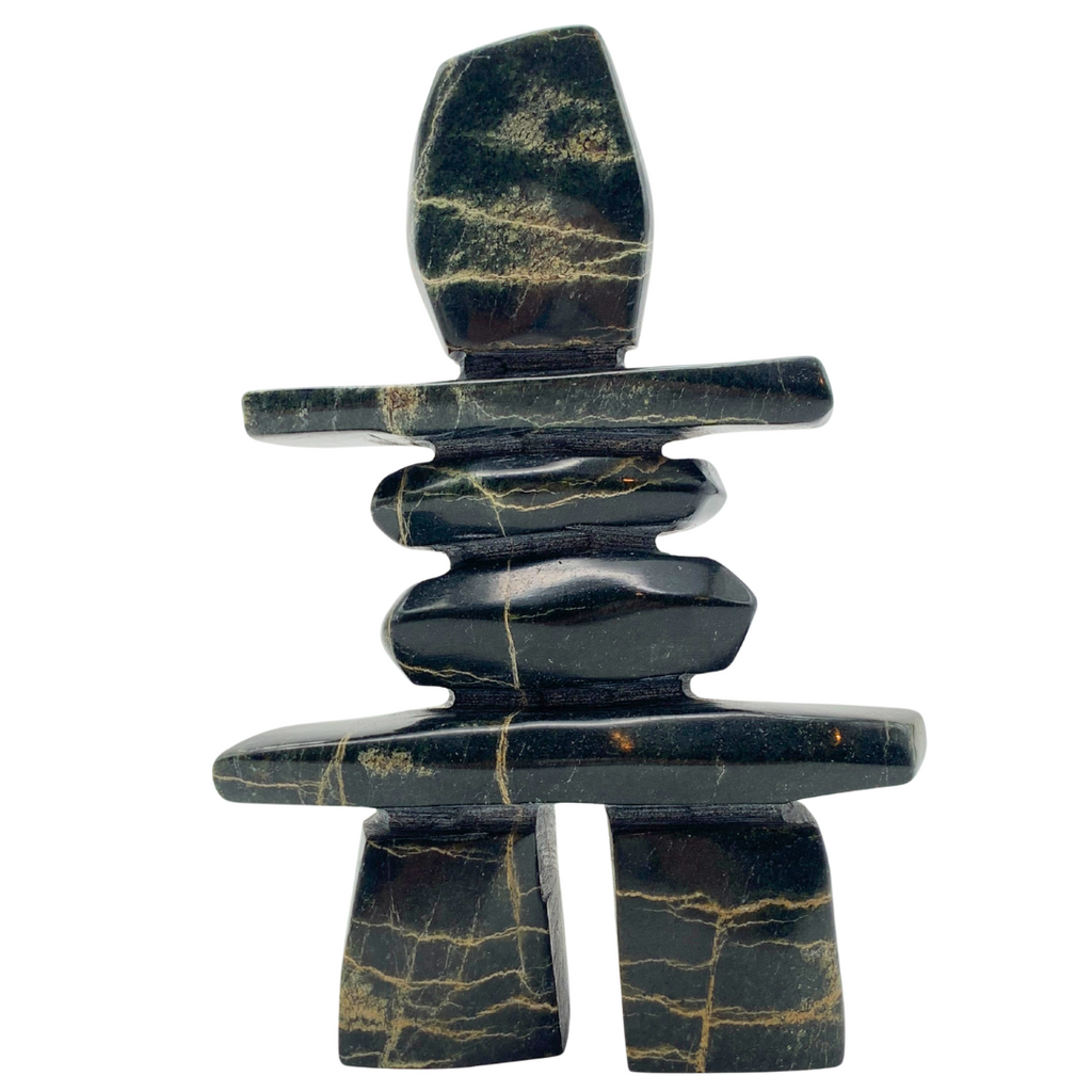 A human-shaped inukshuk sculpture, approximately 5.5 inches high. The soapstone is black with vivid gold lines streaking through it.