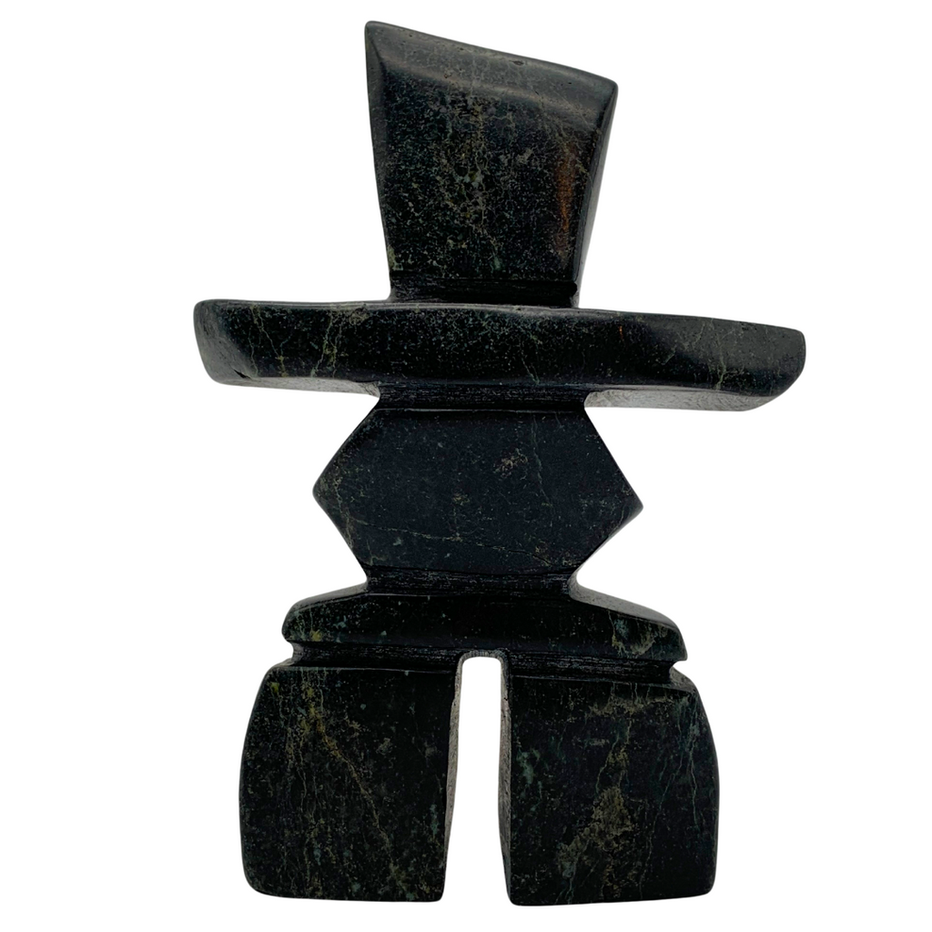 A human-shaped inukshuk sculpture, approximately 5 inches high. The stone is mottled black and green soapstone.