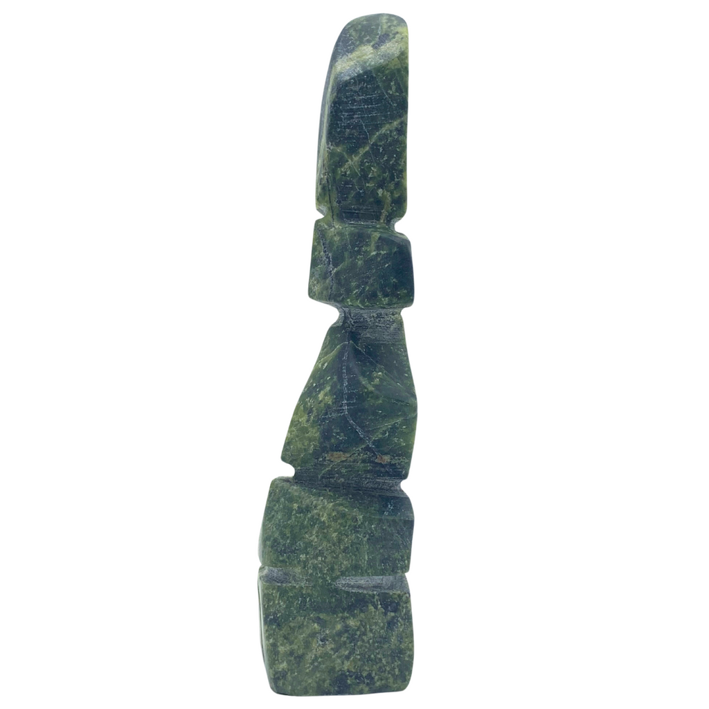 A human-shaped inukshuk sculpture, approximately 4.5 inches high. The stone is mottled black and green soapstone.