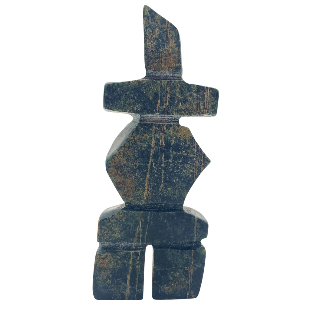 A human-shaped inukshuk sculpture, approximately 3.5 inches high. The stone is mottled black, brown and green soapstone.