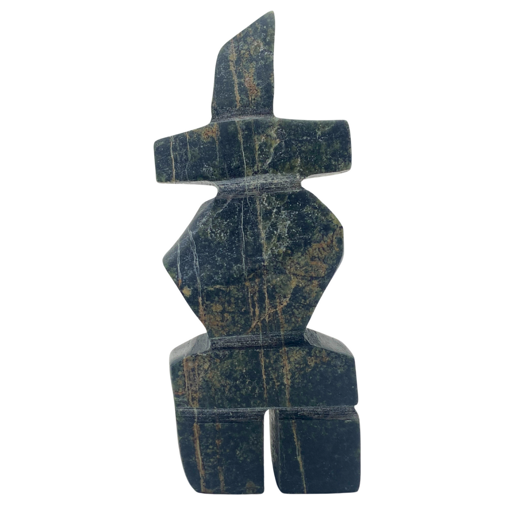 A human-shaped inukshuk sculpture, approximately 3.5 inches high. The stone is mottled black, brown and green soapstone.