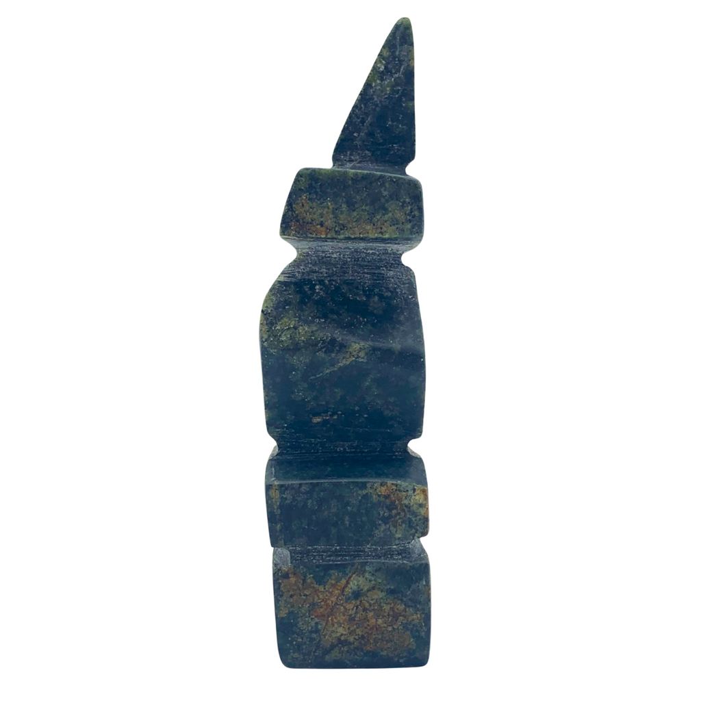 A human-shaped inukshuk sculpture, approximately 3.5 inches high. The stone is mottled black, brown and green soapstone.