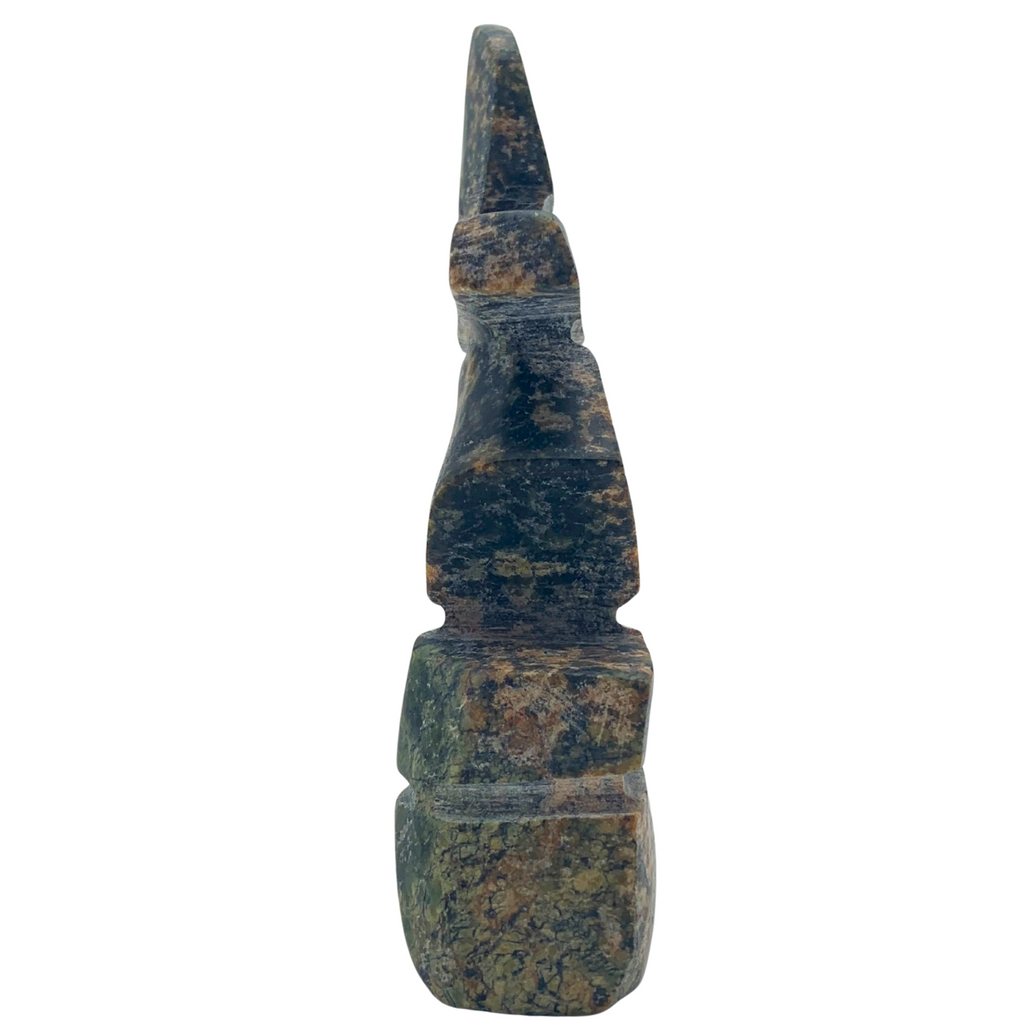 A human-shaped inukshuk sculpture, approximately 3.5 inches high. The stone is mottled black, brown and green soapstone.