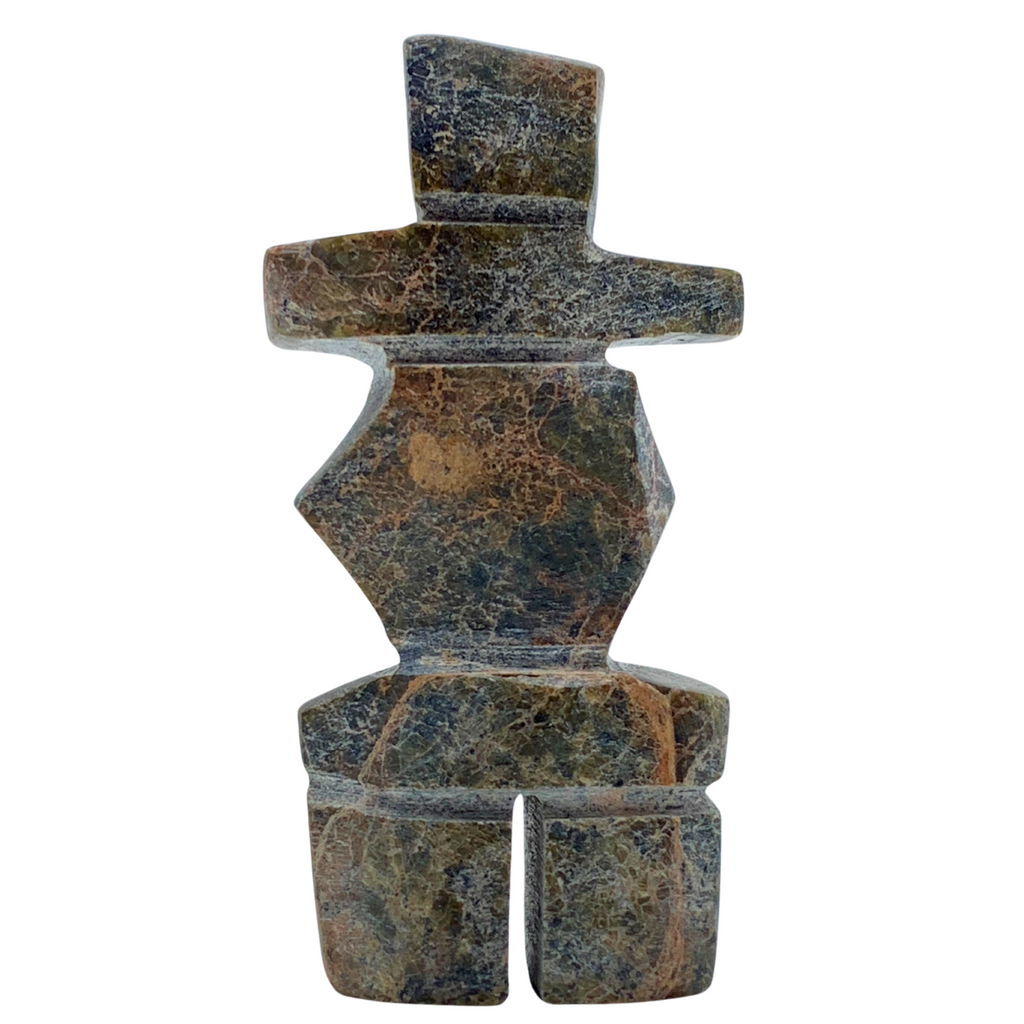 A human-shaped inukshuk sculpture, approximately 3.5 inches high. The stone is mottled black and brown with a natural heart shape on the left side of the torso.