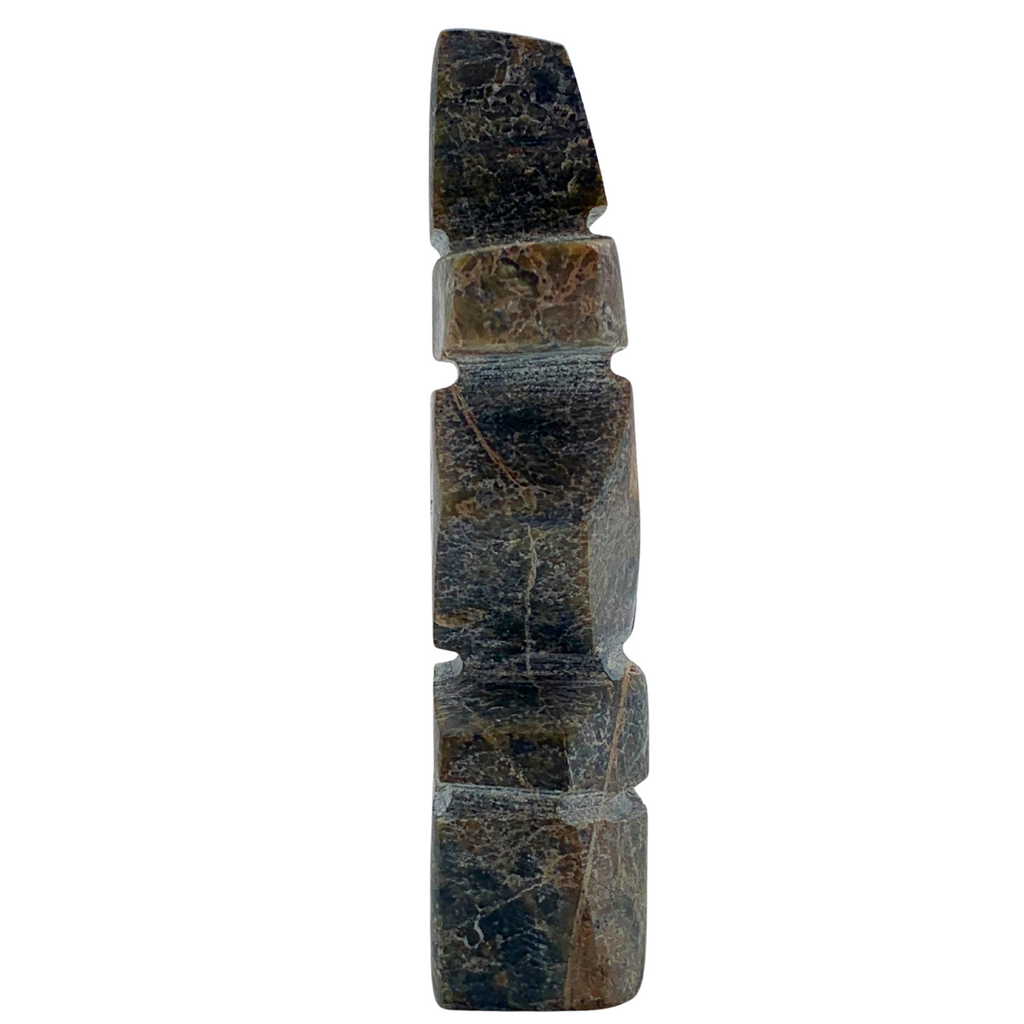 A human-shaped inukshuk sculpture, approximately 3.5 inches high. The stone is mottled black and brown.