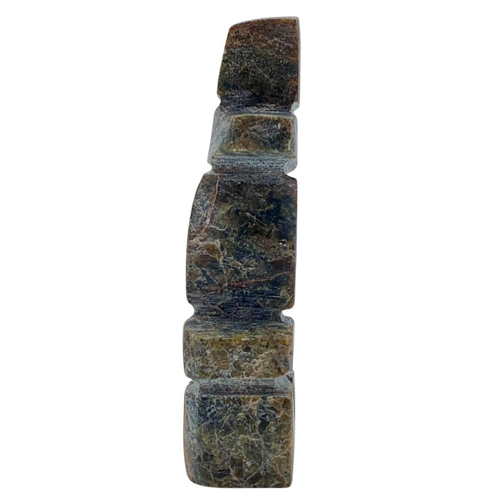 A human-shaped inukshuk sculpture, approximately 3.5 inches high. The stone is mottled black and brown.