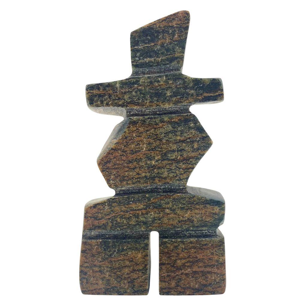 A human-shaped inukshuk sculpture, approximately 3 inches high. The stone is mottled black and brown soapstone.