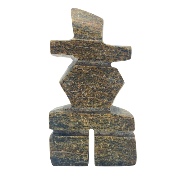 A human-shaped inukshuk sculpture, approximately 3 inches high. The stone is mottled black and brown soapstone.