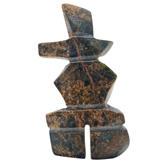 A human-shaped inukshuk sculpture, approximately 3 inches high. The stone is mottled black and brown soapstone.