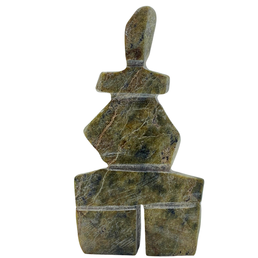 A human-shaped inukshuk sculpture, approximately 4 inches high. The stone is mottled black and green soapstone.