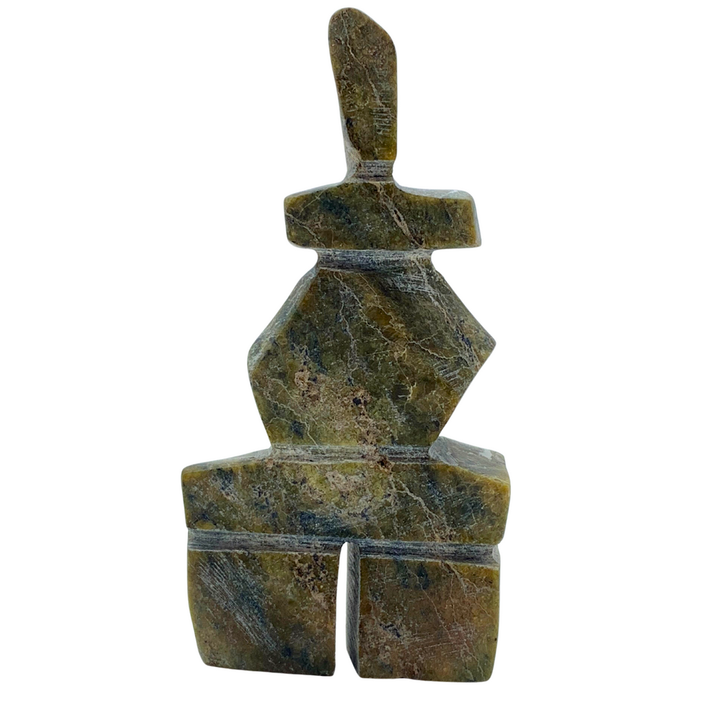 A human-shaped stone sculpture, approximately 4 inches high. The stone is mottled black and green soapstone.