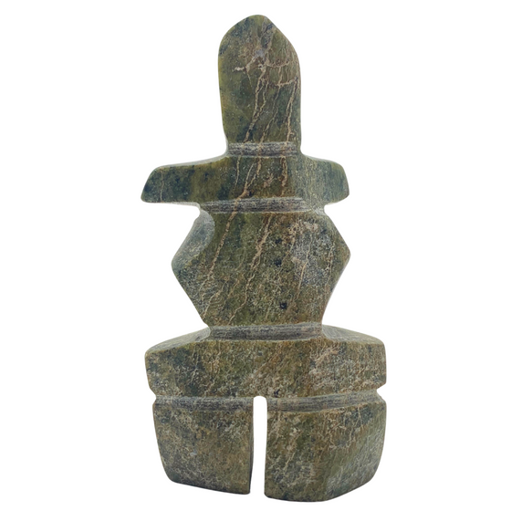 A human-shaped inukshuk sculpture, approximately 3 inches high. The stone is mottled black and green soapstone.