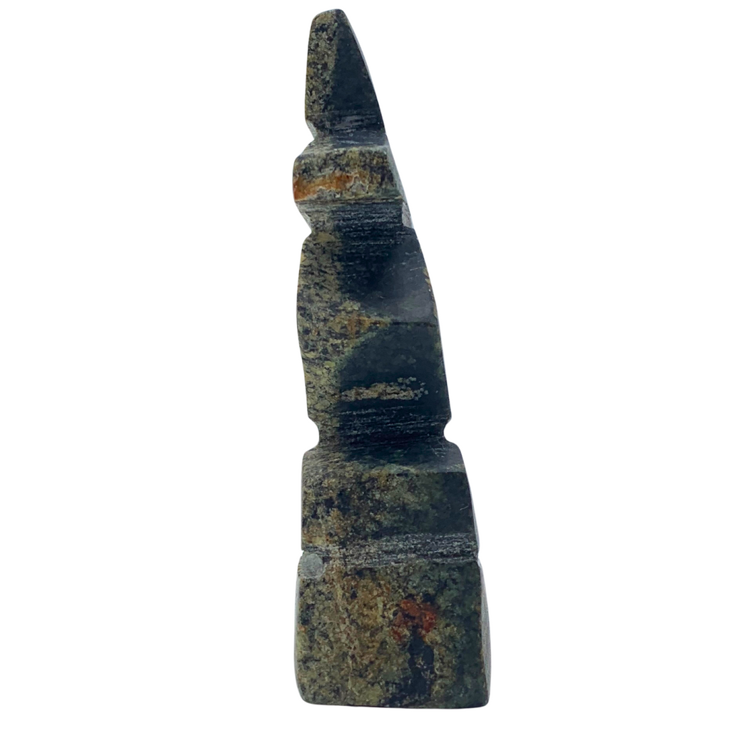 A human-shaped stone sculpture, approximately 3 inches high. The stone is black and brown.