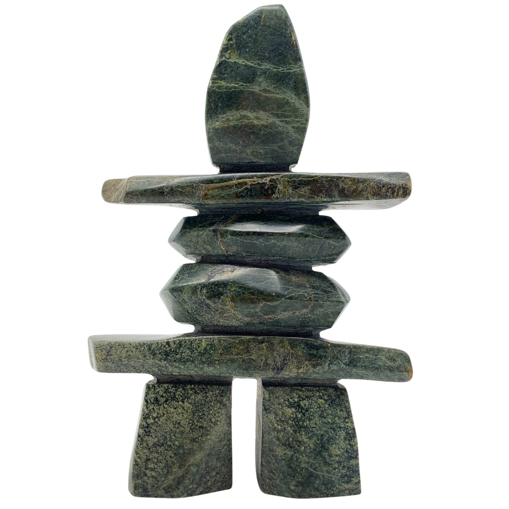 A human-shaped inukshuk sculpture, approximately 5 inches high. The stone is mottled black and green soapstone.