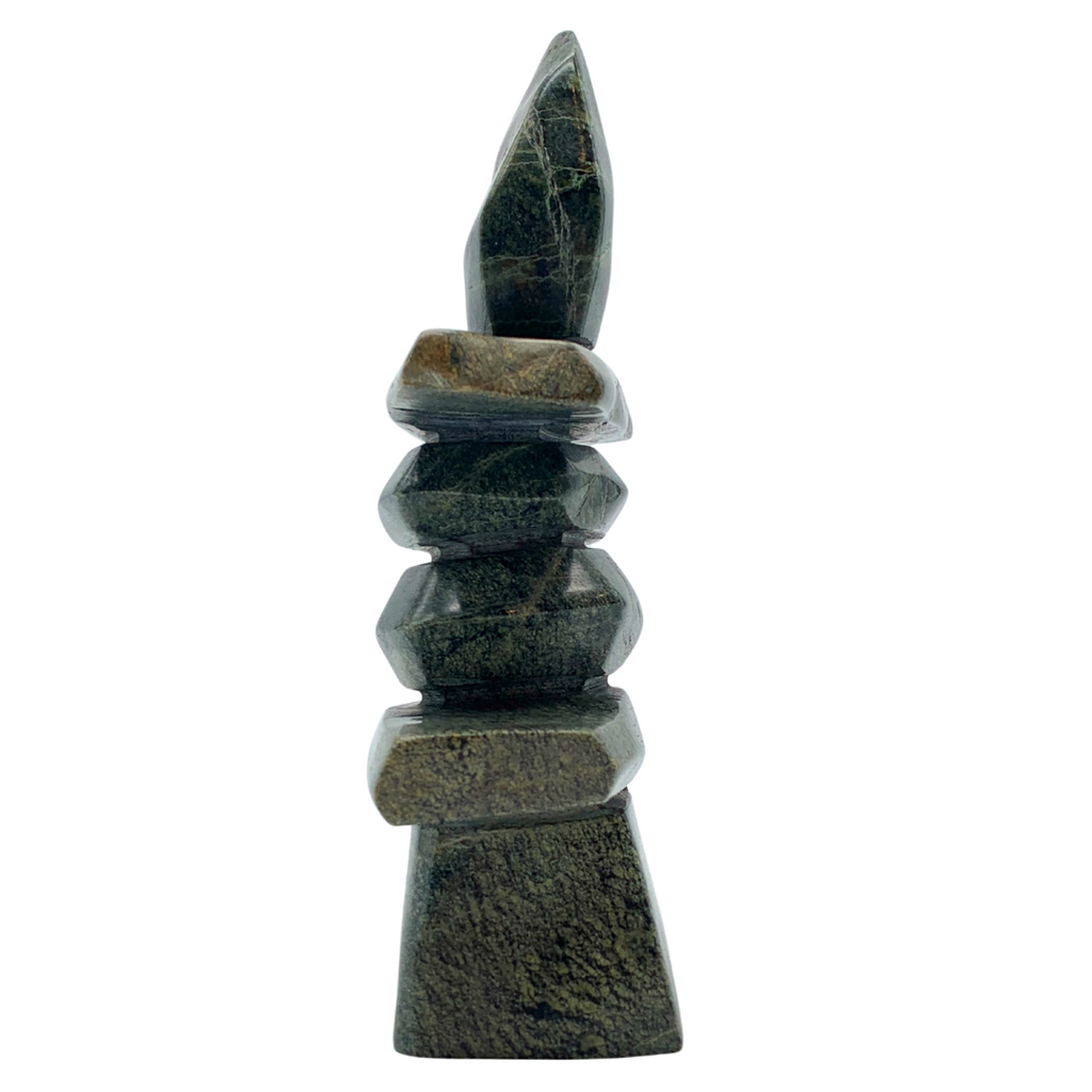 A human-shaped inukshuk sculpture, approximately 5 inches high. The stone is mottled black and green soapstone.