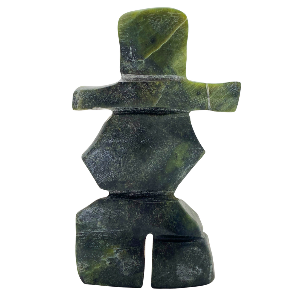 A human-shaped inukshuk sculpture, approximately 4 inches high. The stone is mottled black and green soapstone.