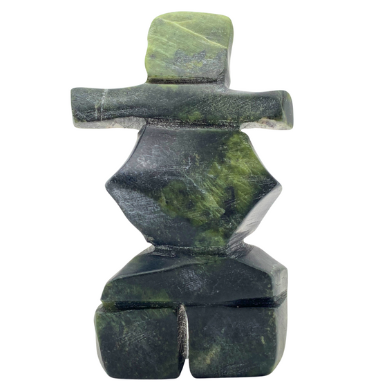 A human-shaped inukshuk sculpture, approximately 4 inches high. The stone is mottled black and green soapstone.