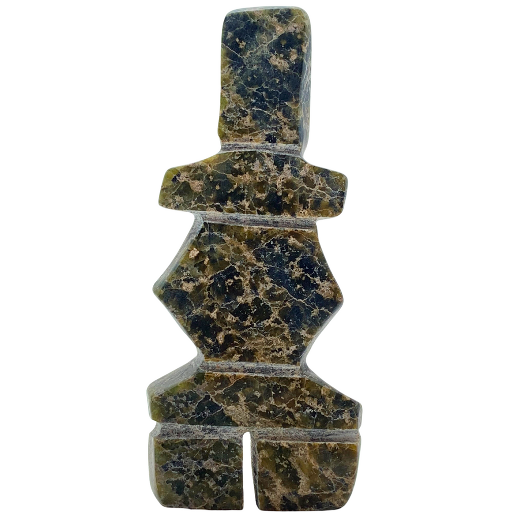 A human-shaped stone sculpture, approximately 4 inches high. The stone is mottled black and green soapstone.