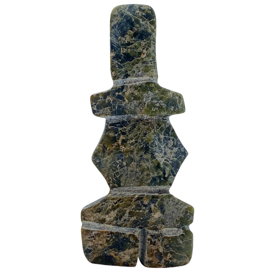 A human-shaped stone sculpture, approximately 4 inches high. The stone is mottled black and green soapstone.