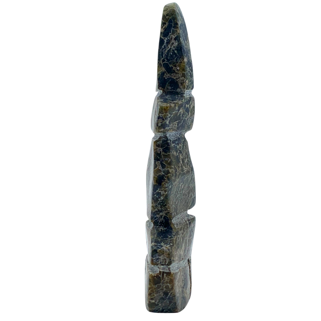 A human-shaped stone sculpture, approximately 4 inches high. The stone is mottled black and green soapstone.