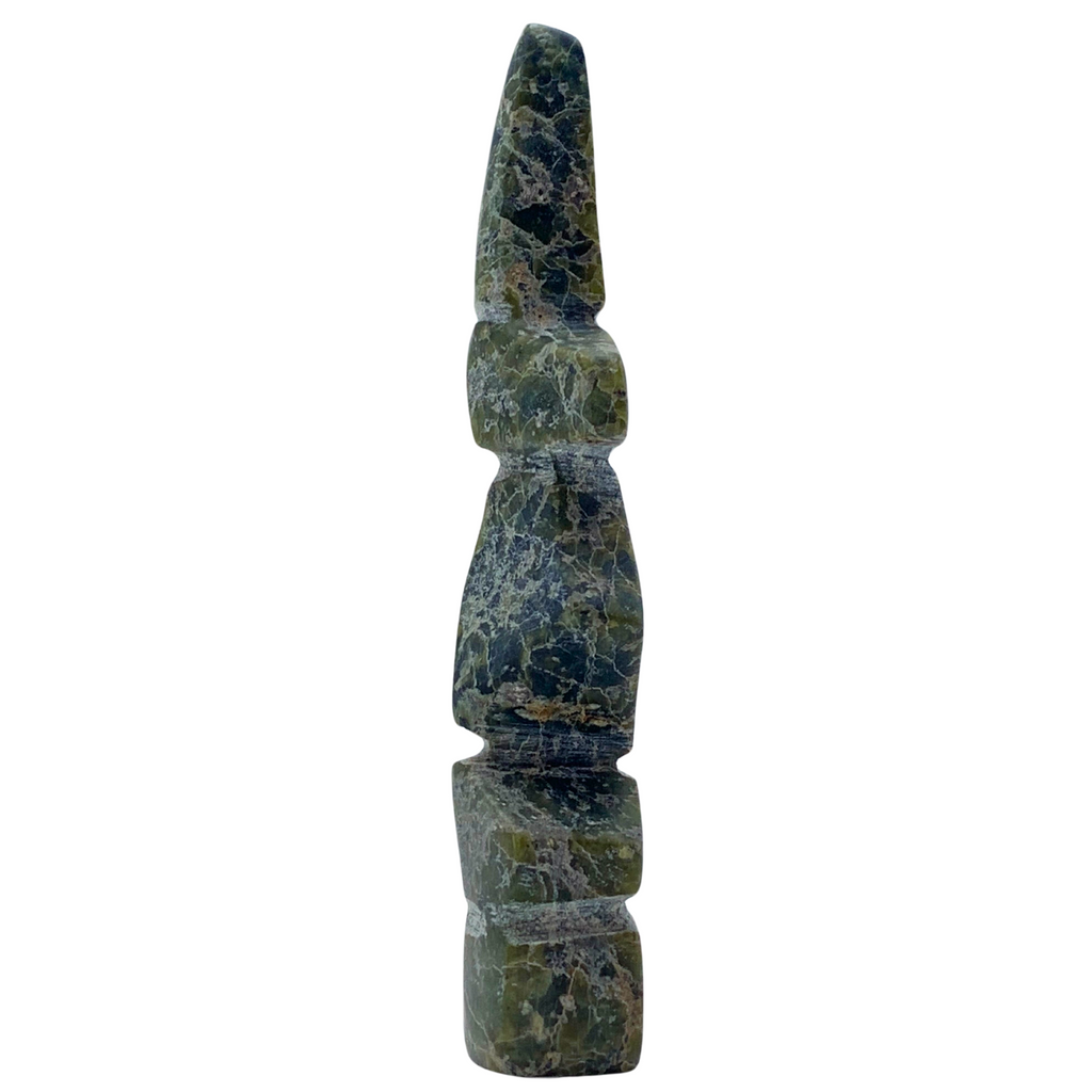 A human-shaped stone sculpture, approximately 4 inches high. The stone is mottled black and green soapstone.