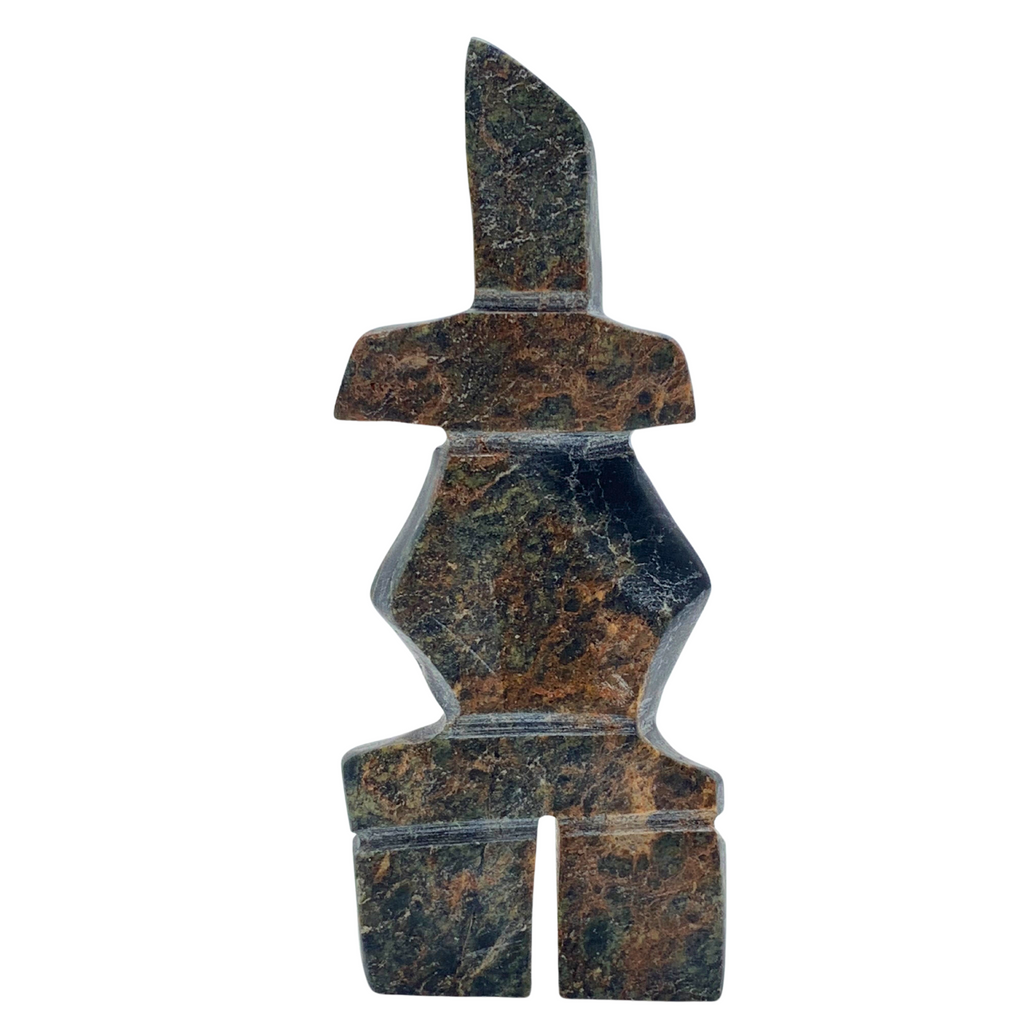 A human-shaped inukshuk sculpture, approximately 4 inches high. The stone is mottled black, brown and green soapstone.