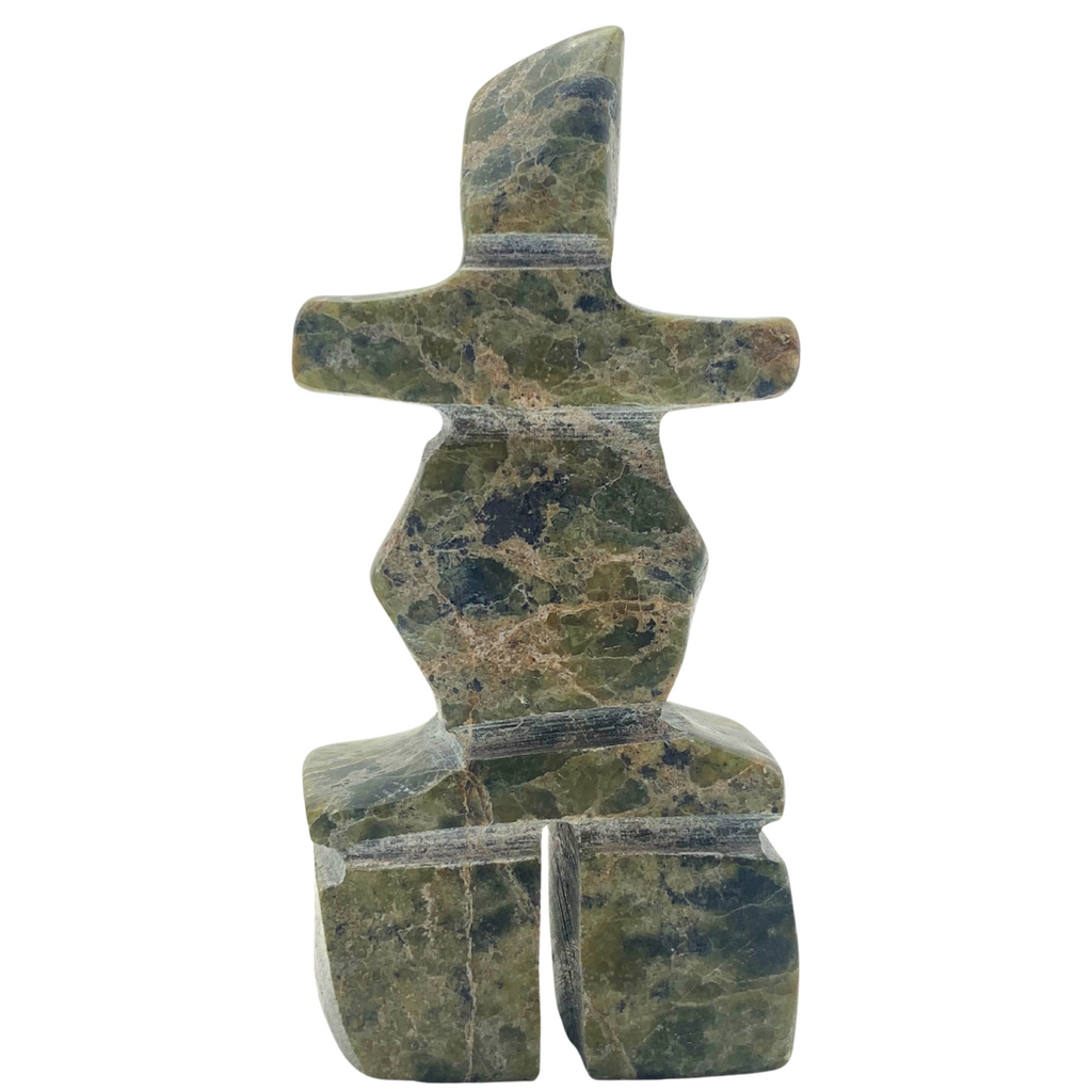 A human-shaped inukshuk sculpture, approximately 3 inches high. The stone is mottled black and green soapstone.