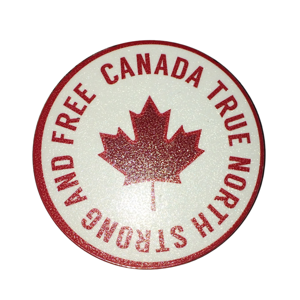 Wooden magnet with gloss coating. White background with red maple leaf in the middle. "Canada true north strong and free" wrapped around the leaf in a circle, surrounded by a red lined boarder. 