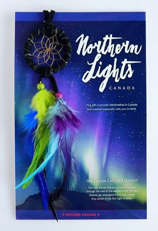 A mini dreamcatcher decorated with black leather and stone and beads and feathers in the brilliant green, blue, and pink of the Northern Lights to mimic a stunning Arctic night sky. The attached card depicts the inspirational picture of Aurora Borealis in all its glory.