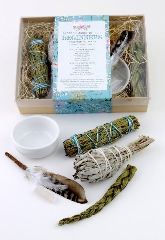 This boxed starter kit contains three bundles of traditional smudging plants, a white ceramic bowl to perform the ceremony, and a brown and white feather fan in an attractive clear box.