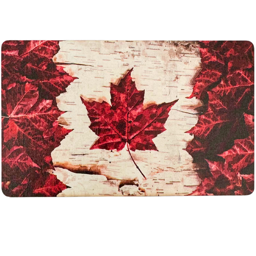 A rectangular magnet of a white and red Canadian flag. The red of the flag is made of red maple leaves, and the white of the flag is birch-bark patterned.