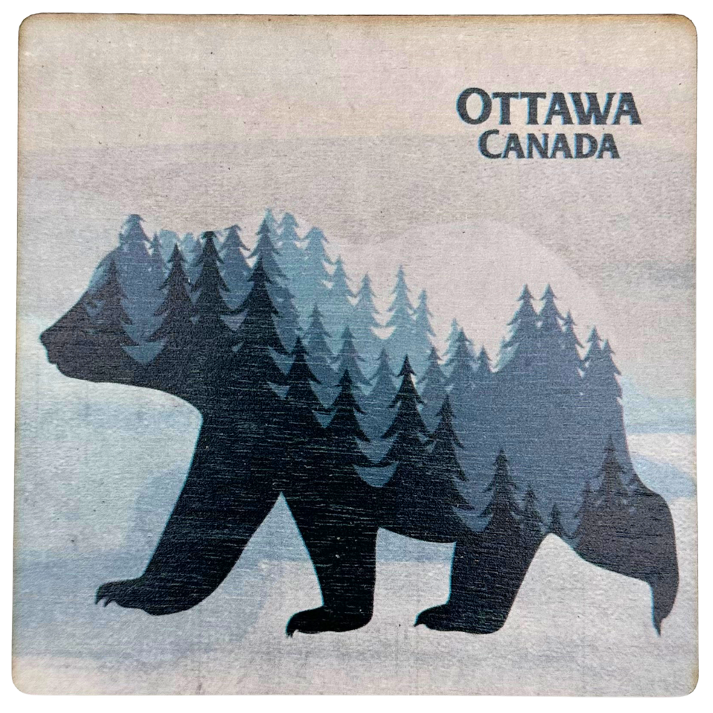 A square magnet featuring the silhouette of a bear walking in a white snowy landscape. The bear's body features a landscape of dark and light blue trees with a white sky. "Ottawa, Canada" is written in dark blue at the top right.