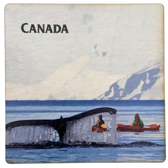 A square magnet featuring two kayakers in blue water, with white snowy mountains behind and a white sky above. In front of the two people, a whale's tail is sticking out of the water. "Canada" is written in black near the top left corner of the picture.