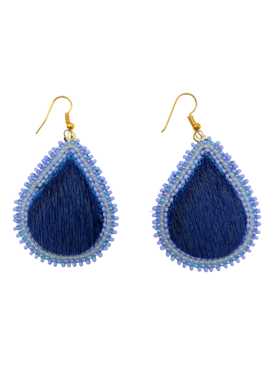 A pair of blue sealskin earrings in the shape of raindrops. They are outlined with lighter blue and white beads and have gold hardware.